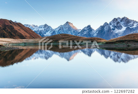 Sunset on mountain lake Koruldi. Upper Svaneti, Georgia, Europe. Caucasus mountains 122697282