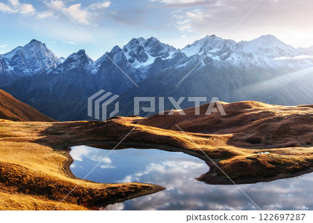 Sunset on mountain lake Koruldi. Upper Svaneti, Georgia, Europe. Caucasus mountains Sunset on mountain lake Koruldi. Upper Svaneti, Georgia, Europe. Caucasus mountains 122697287