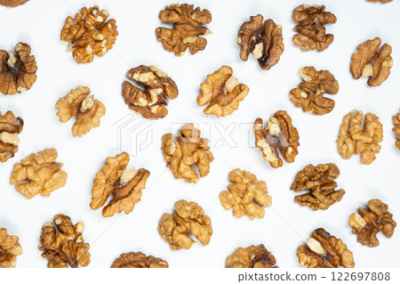Walnut kernels, white background, top view. 122697808