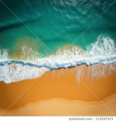 an impressive tropical beach with a view of the ocean waves from above, bright sunlight, yellow sand and blue frothy waves, beautiful nature as a backdrop 122697925