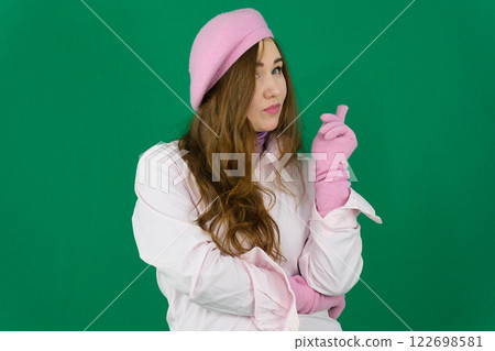 Portrait of authentic young Asian woman wearing sunglasses and stylish casual clothes dancing and looking at camera isolated on pink background. Concept of entertainment advertisement 122698581