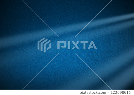 Elegant blue light rays on dark blue background. Abstract blue light background. 122698615
