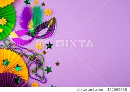 Vibrant Mardi Gras background with mask, beads, and festive decorations 122699066