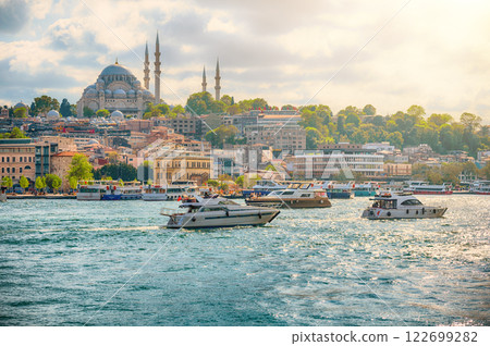 Stunning panoramic view of Istanbul's skyline, featuring the Suleymaniye Mosque and luxury yachts on the Bosphorus Stunning panoramic view of Istanbul's skyline, featuring the Suleymaniye Mosque and luxury yachts on the Bosphorus 122699282