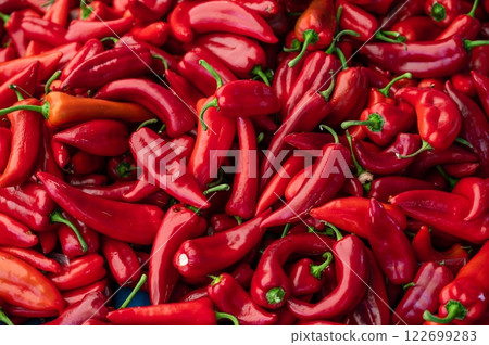 Heap Of Ripe Big Red Peppers At A Street Market. Peppers background 122699283