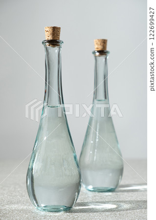Classic table vinegar in a narrow-spout vinegar bottles with a corks Classic table vinegar in a narrow-spout vinegar bottles with a corks 122699427