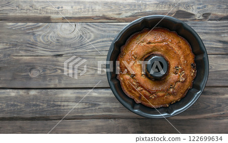 baking background. Bakery. Autumn baking table scene with pumpkin pie ingredients on a dark wood background. 122699634