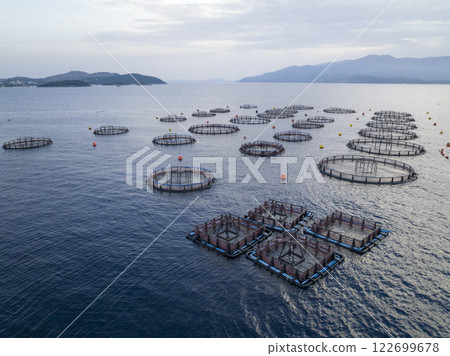 Aerial shot of Aquaculture sea fish Floating farming cages, offshore marine seafood industry in Adriatic Sea. Salmon. 122699678