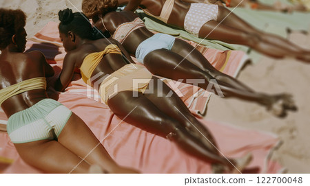 Sun Kissed Women on Beach Towels Sun Kissed Women on Beach Towels 122700048