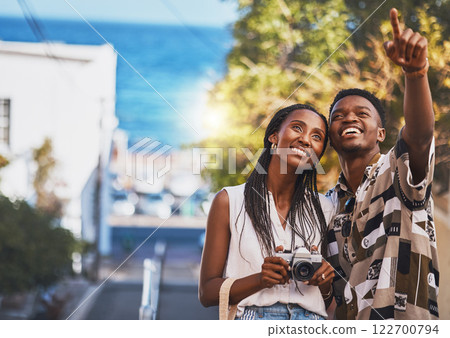 Photographer couple on summer vacation or holiday abroad and tourism with lens flare, ocean and street background. Black people, man and woman looking at tourist destination for travel photography Photographer couple on summer vacation or holiday abroad and tourism with lens flare, ocean and street background. Black people, man and woman looking at tourist destination for travel photography 122700794