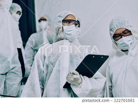 Doctors, healthcare workers and health team doing inspection, cleaning a building during covid pandemic and checking for danger. Employees wearing masks to protect from virus at a working site 122701081