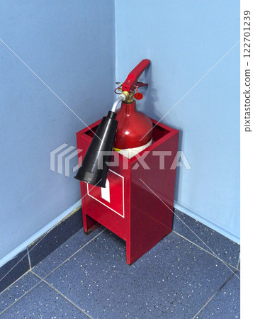 Fire safety equipment displayed in a corner of a modern building Fire safety equipment displayed in a corner of a modern building 122701239