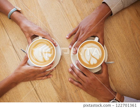 Creative latte art, cappuccino and coffee drink in cafe with couple and friends enjoying cup of java with milk froth together. Closeup of people hands from above meeting and drinking in restaurant 122701361