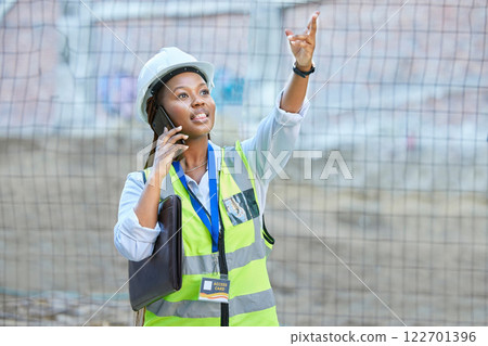 Engineer, construction worker or maintenance and development woman on a phone call while working. Building management employee or manager planning and consulting real estate building project outdoors Engineer, construction worker or maintenance and development woman on a phone call while working. Building management employee or manager planning and consulting real estate building project outdoors 122701396