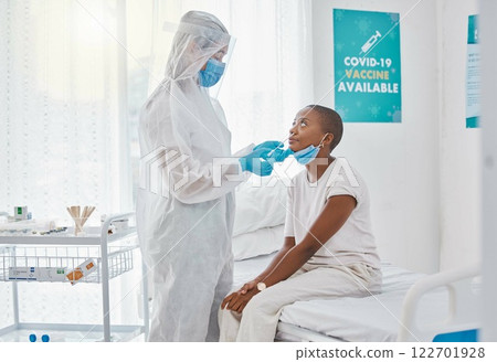 Corona virus nasal swab of covid patient in a hospital room with testing equipment. Medical worker, nurse or doctor taking nose or nasal sample for protocol, routine covid19 disease test in a clinic 122701928