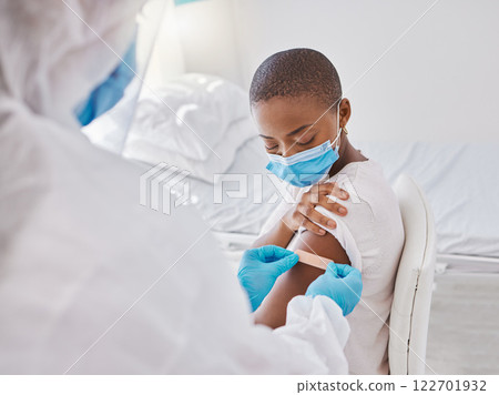 Band aid, vaccine or injection for covid, flu or pandemic virus to protect from disease, sickness or illness. Hazmat suit doctor, medical professional or healthcare worker and plaster for patient arm 122701932