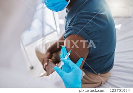 Vaccine, injection or medicine cure for covid, monkeypox and ebola with trust doctor, healthcare or medical worker. Physician in hazmat suit with wellness treatment for patient arm at hospital clinic 122701934