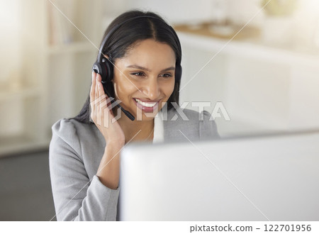 Call center agent or CRM business woman talking on phone with headset and computer offering client support and help. Contact us for telemarketing worker or customer service support consultant. 122701956