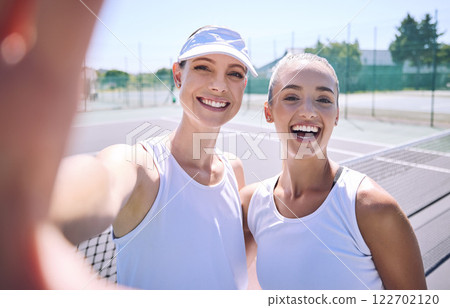 Selfie taking team of female tennis players on the court after a game, match or tournament portrait. Fit sporty teammates, athletes or professionals relax after being active, exercise and training 122702120