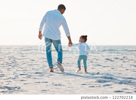 Dad, beach or holding hands with toddler for walk, bonding or support of family trust on ocean coast. Back view, father and child or kid strolling with parent on sandy shore for summer holiday by sea 122702218