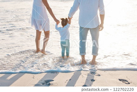 Beach, mother and father with child for holding hands, travel holiday and bonding together outdoor. Parents, mom and dad with girl for family relationship, support and vacation experience on ocean 122702220