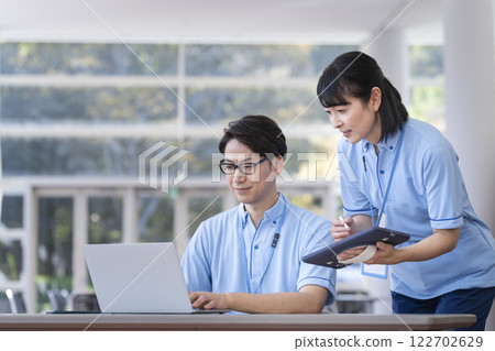 Facility staff having a meeting 122702629