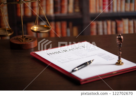 Notary's public pen and stamp on a contract. Notary's public pen and stamp on a contract. 122702670