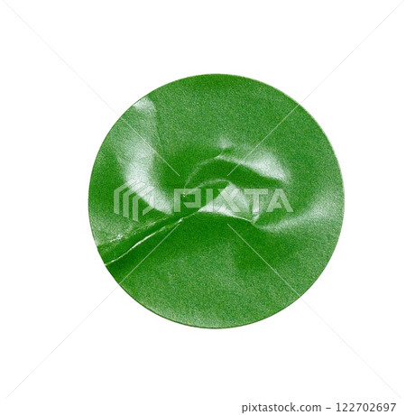 Blank green round crumpled paper promotion sticker label cutout isolated on a white background 122702697