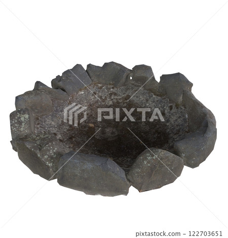 Rustic stone fire pit made from large rocks in outdoor setting 122703651