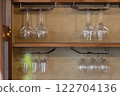 Wine glasses displayed on a shelf 122704136