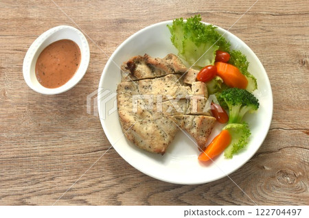 grilled slice chicken breast steak black pepper with barbecue sauce and baking vegetable salad on plate grilled slice chicken breast steak black pepper with barbecue sauce and baking vegetable salad on plate 122704497