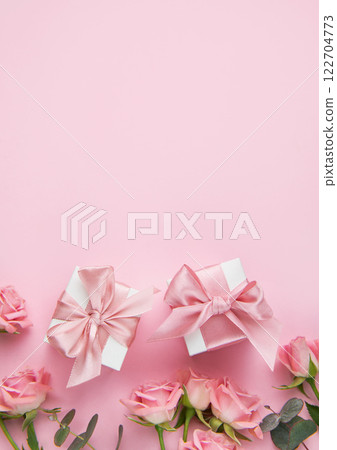 Pink roses and gift boxes on pink background for mother's day or valentine's day 122704773