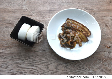 braised slice pork belly with preserved mustard on plate eat couple white steamed Chinese bun braised slice pork belly with preserved mustard on plate eat couple white steamed Chinese bun 122704838