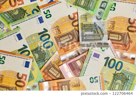 Pile of euro money in banknotes of 100,50,10 and 5 denominations top view. Pile of euro money in banknotes of 100,50,10 and 5 denominations top view. 122706464