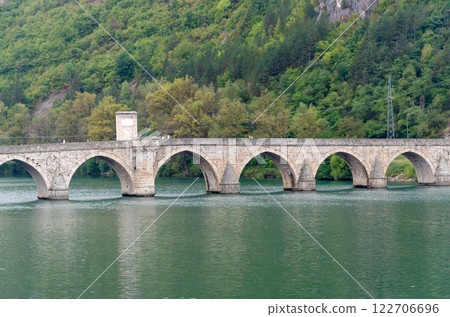 Elegant arches of the bridge on the river Drina famous also by Ivo Andric's novel Elegant arches of the bridge on the river Drina famous also by Ivo Andric's novel 122706696