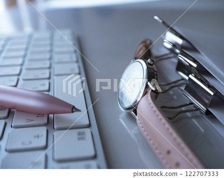 Documents, keyboard, and watch on the table Documents, keyboard, and watch on the table 122707333