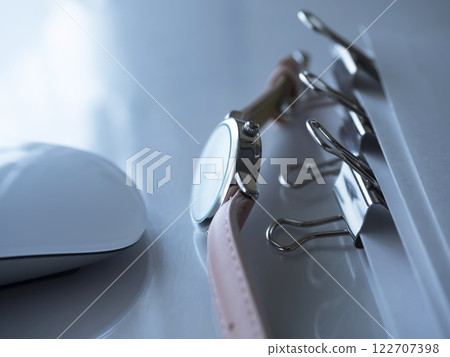 Documents and a watch on the table 122707398