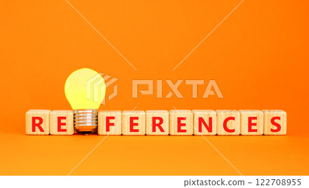 References symbol. Concept word References on beautiful wooden blocks. Beautiful orange table orange background. Yellow light bulb. Business references reference concept. Copy space. References symbol. Concept word References on beautiful wooden blocks. Beautiful orange table orange background. Yellow light bulb. Business references reference concept. Copy space. 122708955