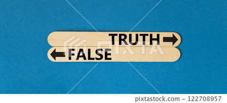 Truth or false symbol. Concept word Truth or False on beautiful wooden stick. Beautiful blue table blue background. Business and truth or false concept. Copy space. Truth or false symbol. Concept word Truth or False on beautiful wooden stick. Beautiful blue table blue background. Business and truth or false concept. Copy space. 122708957