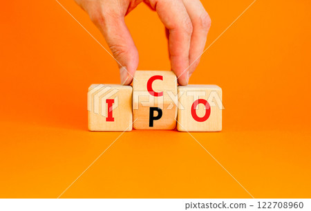 Initial public or coin offering symbol. Concept words abbreviation IPO or ICO on wooden block. Beautiful orange table orange background. Business Initial public or coin offering concept. Copy space. Initial public or coin offering symbol. Concept words abbreviation IPO or ICO on wooden block. Beautiful orange table orange background. Business Initial public or coin offering concept. Copy space. 122708960