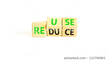 Reuse or reduce symbol. Concept words Reuse Reduce on wooden block. Beautiful white table white background. Business reuse or reduce concept. Copy space. 122708961