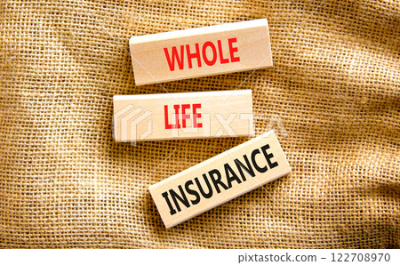 Whole life insurance symbol. Concept words Whole life insurance on beautiful wooden blocks. Beautiful canvas table canvas background. Business whole life insurance concept. Copy space. 122708970