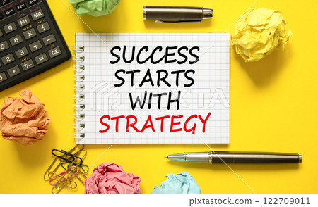 Success starts with strategy symbol. Concept words Success starts with strategy on beautiful white note. Beautiful yellow background. Business and success starts with strategy concept. Copy space. Success starts with strategy symbol. Concept words Success starts with strategy on beautiful white note. Beautiful yellow background. Business and success starts with strategy concept. Copy space. 122709011