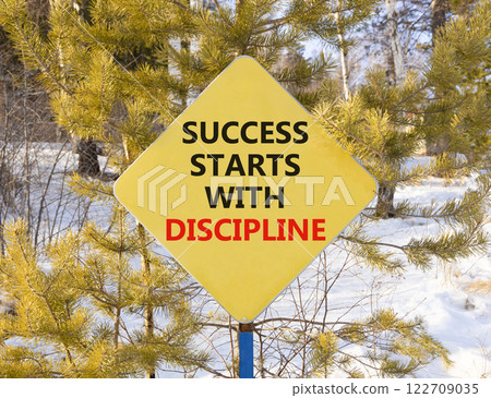 Success starts with discipline symbol. Concept words Success starts with discipline on beautiful road sign. Beautiful forest background. Business success starts with discipline concept. Copy space Success starts with discipline symbol. Concept words Success starts with discipline on beautiful road sign. Beautiful forest background. Business success starts with discipline concept. Copy space 122709035