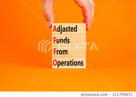 AFFO symbol. Concept word AFFO Adjusted Funds From Operations on beautiful wooden blocks. Beautiful orange background. Business AFFO Adjusted Funds From Operations concept. Copy space. AFFO symbol. Concept word AFFO Adjusted Funds From Operations on beautiful wooden blocks. Beautiful orange background. Business AFFO Adjusted Funds From Operations concept. Copy space. 122709051