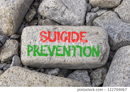 Suicide prevention symbol. Concept words Suicide prevention on beautiful big grey stone. Beautiful grey stones background. Psychological and suicide prevention concept. Copy space. 122709067