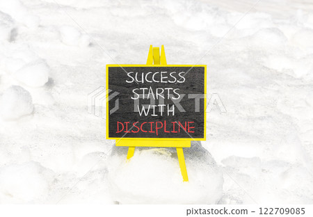 Success starts with discipline symbol. Concept words Success starts with discipline on beautiful blackboard. Beautiful snow background. Business success starts with discipline concept. Copy space 122709085