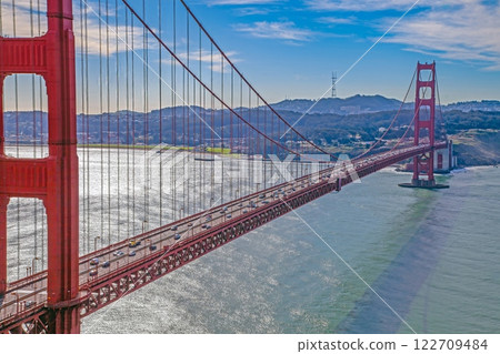 Golden Gate Bridge with blue sky and scenic ocean view from a high vantage point 122709484