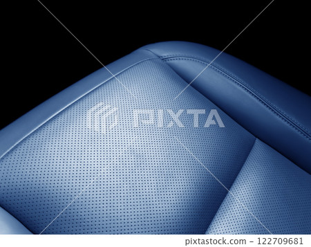 Car blue leather interior. Part of black leather car seat details with white stitching. Interior of prestige car. Perforated leather seats isolated. Perforated leather. Car blue leather interior. Part of black leather car seat details with white stitching. Interior of prestige car. Perforated leather seats isolated. Perforated leather. 122709681