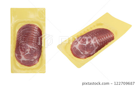 Sliced smoked beef meat in vacuum package isolated on white background. Raw smoked packaged meet isolated 122709687